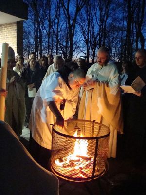 Roman Catholic monks of the Order of Saint Benedict preparing to light the Christ candle prior to Easter Vigil mass at St. Mary's Abbey in Morristown, New Jersey. (Photo: John Stephen Dwyer)